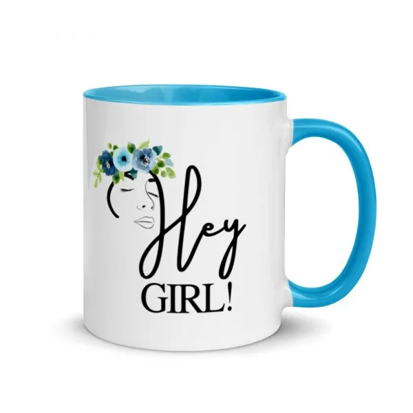 White mug with a blue handle, featuring "Hey GIRL!" and a line-drawn face with blue and green flower crown.